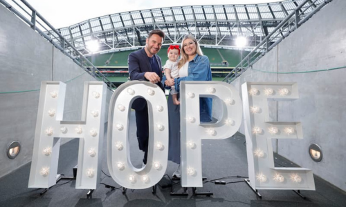 Men and woman behind a HOPE sign